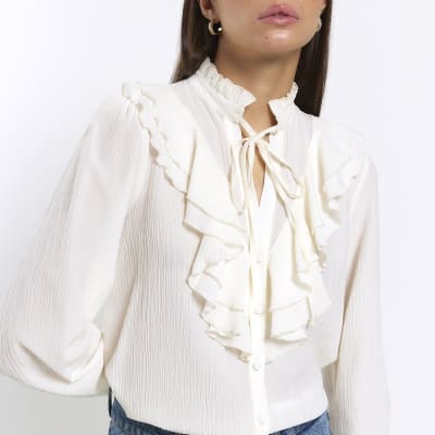 Cream frill long sleeve blouse | River Island