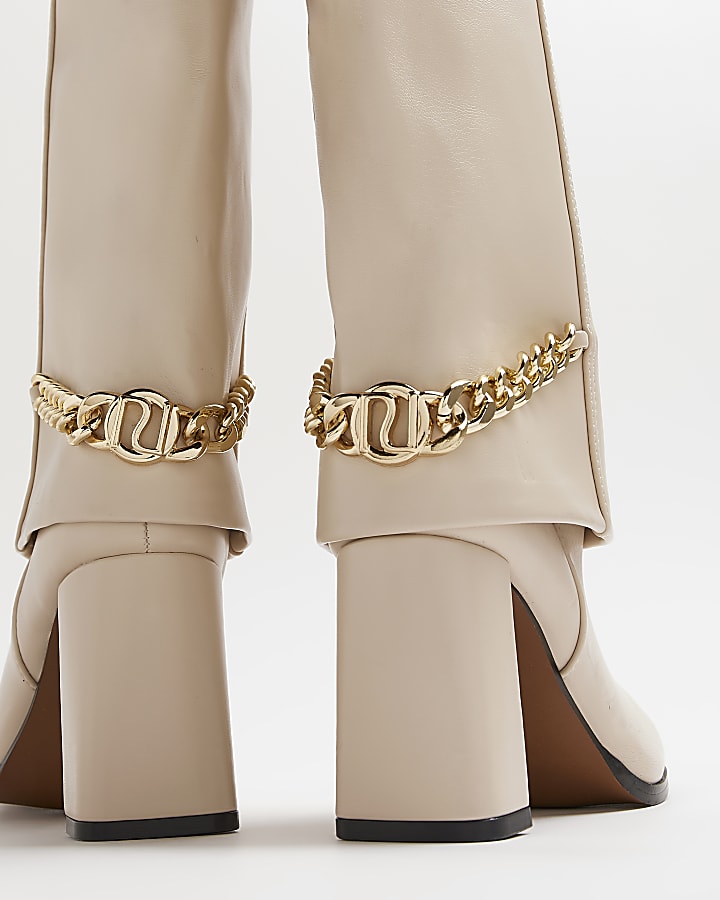 Cream heeled knee high fold over boots
