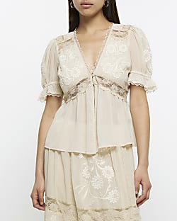 Cream lace embroidered peplum blouse