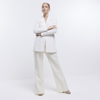Cream lace flared trousers River Island