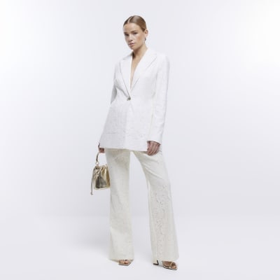 Cream lace flared trousers River Island