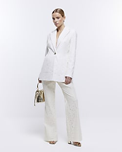 Cream lace flared trousers