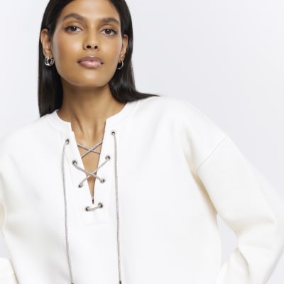Cream lace up sweatshirt River Island