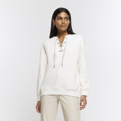 Cream lace up sweatshirt River Island