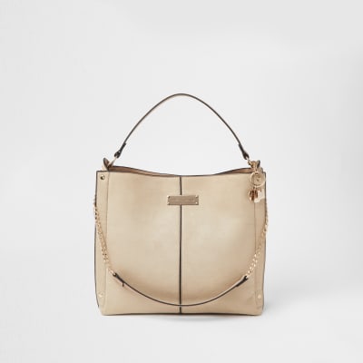 Cream patent embossed slouch handbag