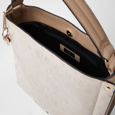 Cream patent embossed slouch handbag