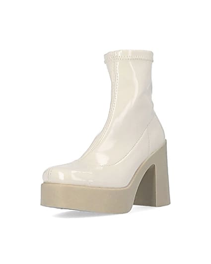 360 degree animation of product Cream patent heeled ankle boots frame-0