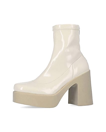 360 degree animation of product Cream patent heeled ankle boots frame-2