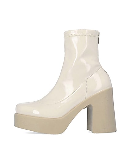 360 degree animation of product Cream patent heeled ankle boots frame-3
