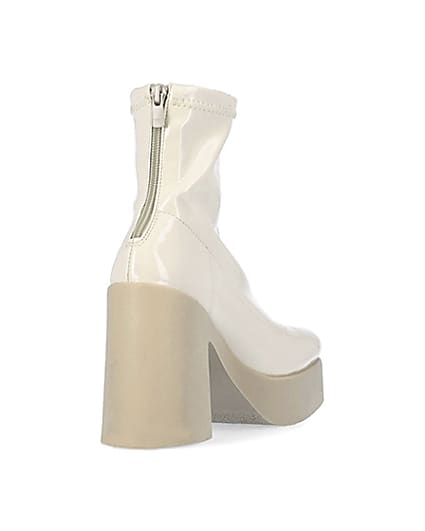 360 degree animation of product Cream patent heeled ankle boots frame-11