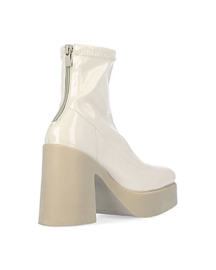 360 degree animation of product Cream patent heeled ankle boots frame-12