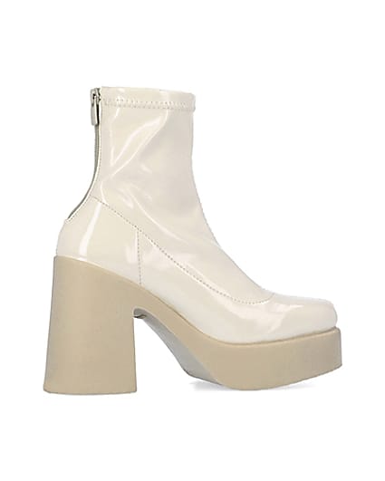 360 degree animation of product Cream patent heeled ankle boots frame-14