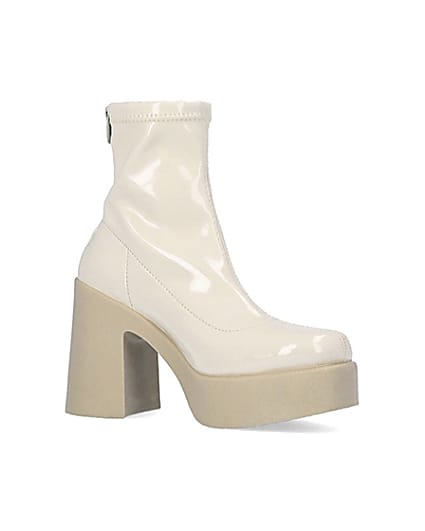 360 degree animation of product Cream patent heeled ankle boots frame-17