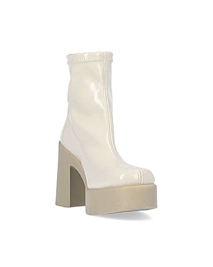 360 degree animation of product Cream patent heeled ankle boots frame-19