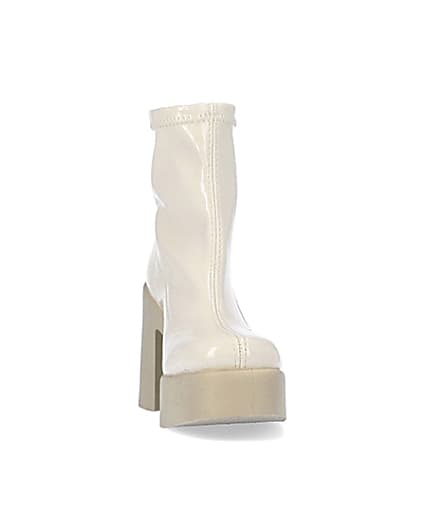360 degree animation of product Cream patent heeled ankle boots frame-20