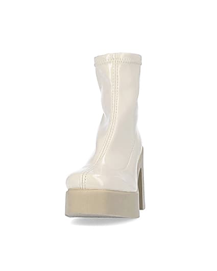 360 degree animation of product Cream patent heeled ankle boots frame-22