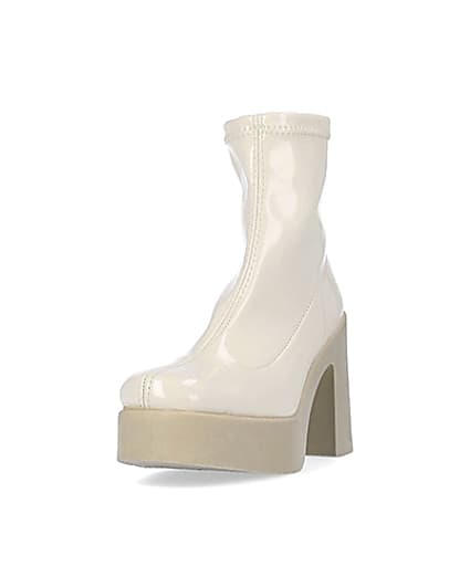 360 degree animation of product Cream patent heeled ankle boots frame-23
