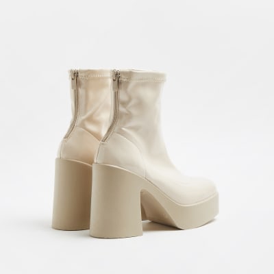 Cream patent heeled ankle boots River Island