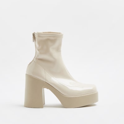 Cream patent heeled ankle boots | River Island