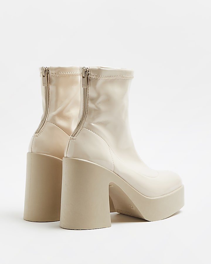 Cream patent heeled boots