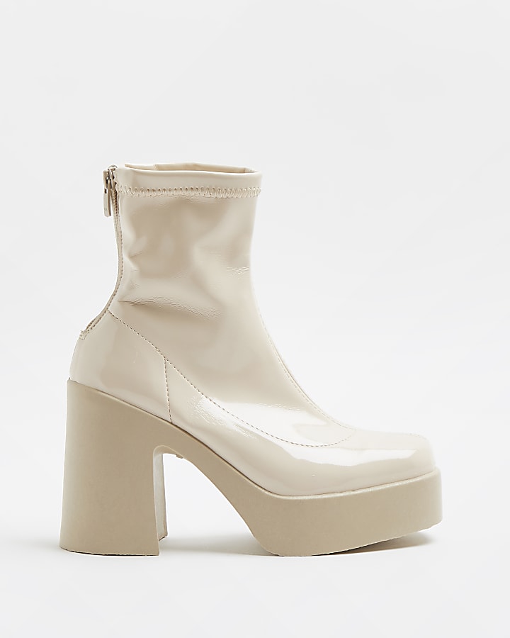 Cream patent heeled boots