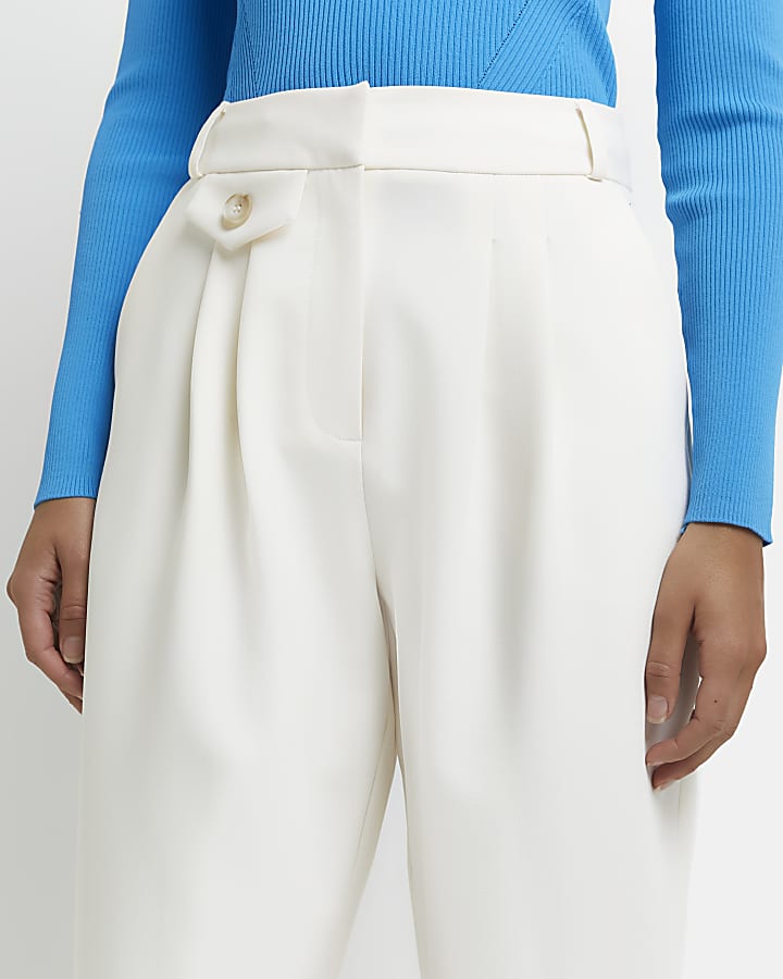 Cream pleated tapered trousers