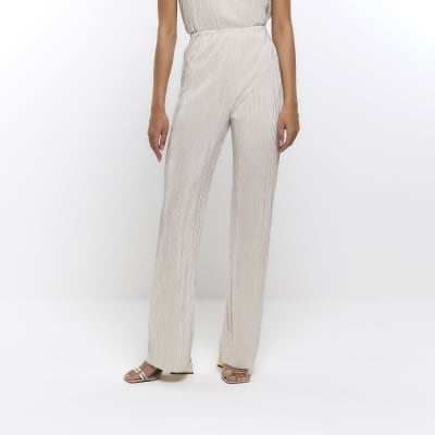 Cream plisse flared trousers River Island