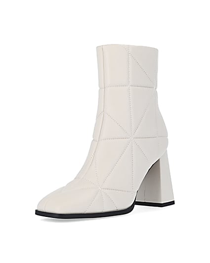 360 degree animation of product Cream quilted heeled ankle boots frame-0