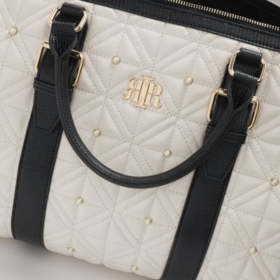 Cream quilted pearl travel bag River Island