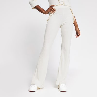 cream flared trousers