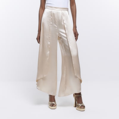 Cream satin wrap over wide leg trousers