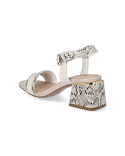 360 degree animation of product Cream snake printed block heel sandals frame-6