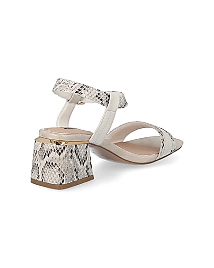 360 degree animation of product Cream snake printed block heel sandals frame-12