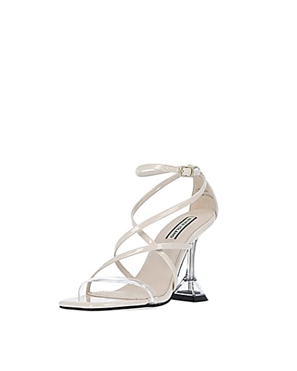 360 degree animation of product Cream strappy perspex heels frame-0