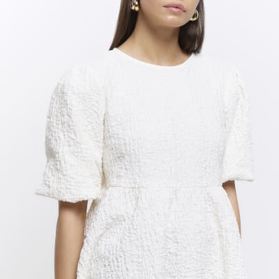 Cream textured peplum short sleeve top