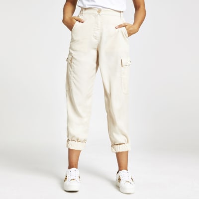 nude flare trousers