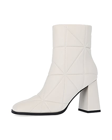 360 degree animation of product Cream wide fit quilted heeled ankle boots frame-2