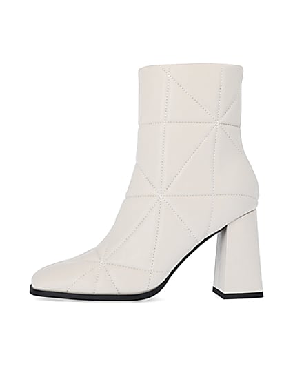 360 degree animation of product Cream wide fit quilted heeled ankle boots frame-3