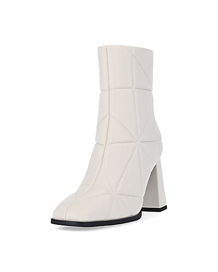 360 degree animation of product Cream wide fit quilted heeled ankle boots frame-23