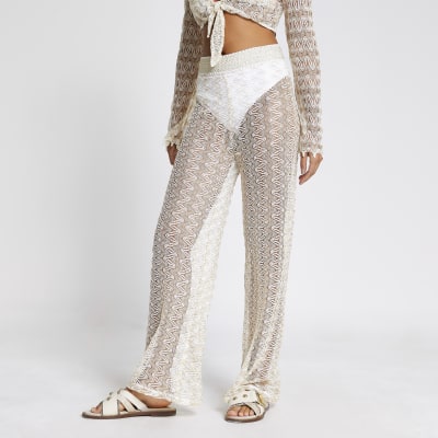 Cream zig-zag knit flared beach trousers