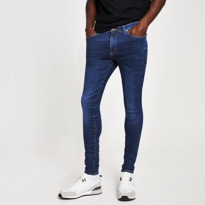 Dark blue Ollie spray on super skinny jeans | River Island