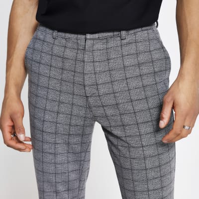 black shirt grey check trousers