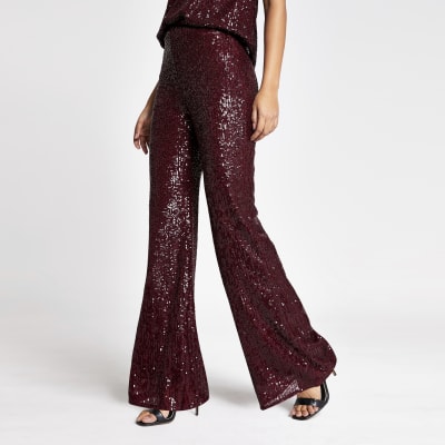 Dark red sequin embellished flare trousers | River Island