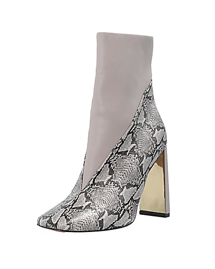 360 degree animation of product Ecru animal print heeled ankle boots frame-0