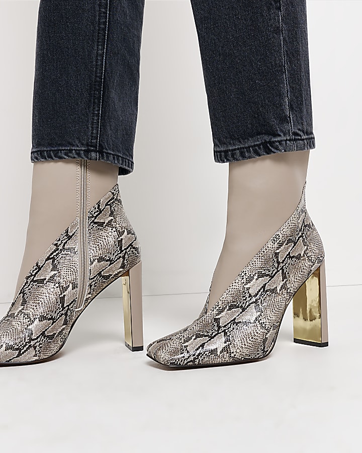 Ecru animal print heeled ankle boots