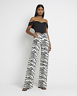 Ecru zebra print high waisted wide leg jeans
