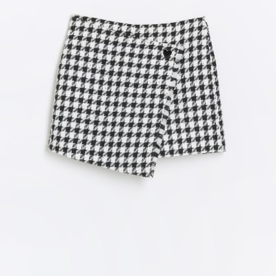 Girls black boucle dogtooth wrap skort River Island