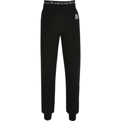 Girls black cuffed hem joggers | River Island