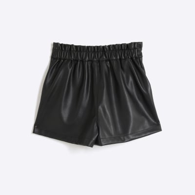 Girls black faux leather button shorts River Island