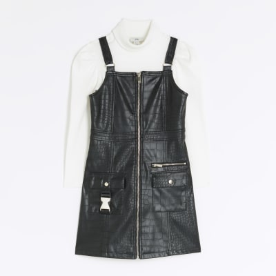 Girls black faux leather pinafore dress River Island